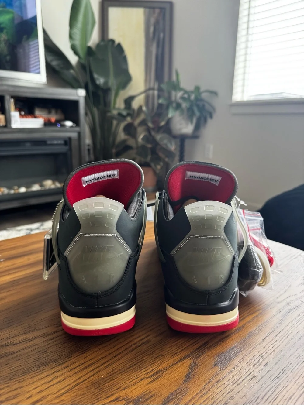 Air Jordan Sneakers. Men's 11 Black/Grey Basketball Sneakers with Red Accents